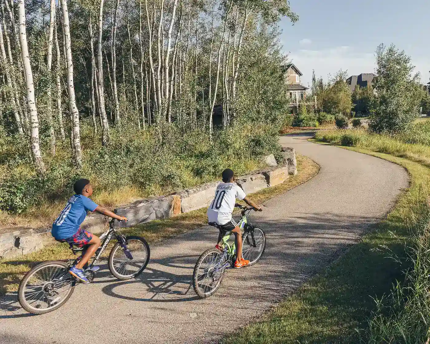 Kids biking along path in Watermark